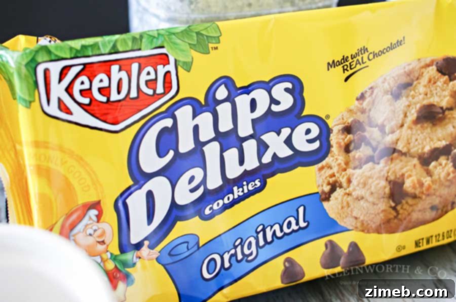 Choc Chip Cookie Fro-Yo Delight 3 A hand reaching for a pack of Keebler Chips Deluxe cookies in a grocery store aisle