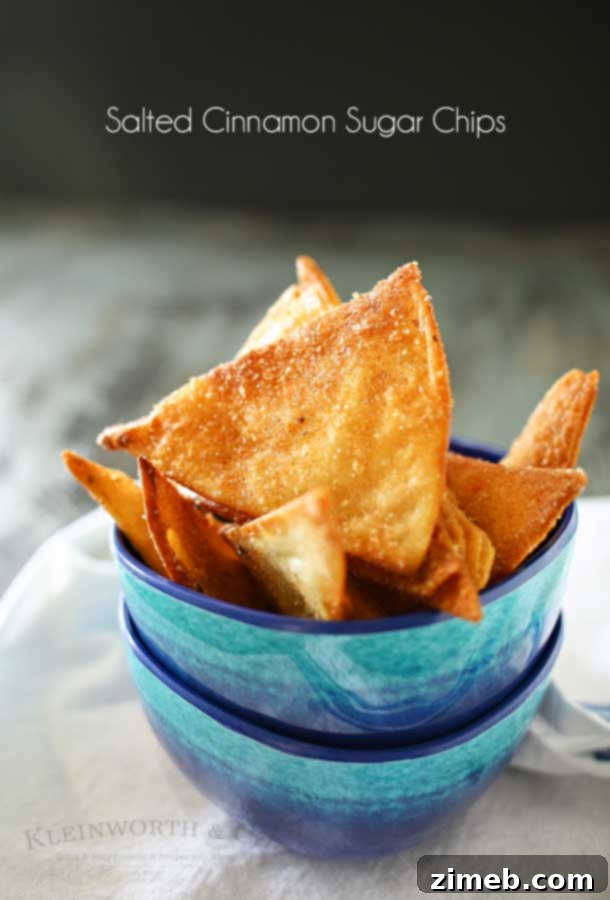 Sweet and Salty Cinnamon Sugar Chips 4 A bowl of homemade Salted Cinnamon Sugar Chips with a person reaching for one.