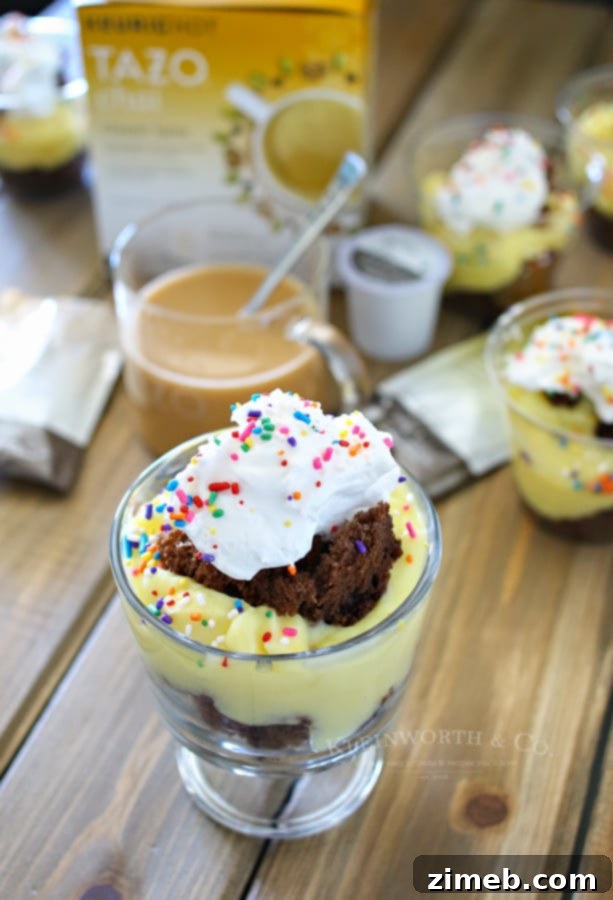 Chai and Mini Crash Cake Delights 5 A serene outdoor setting featuring a perfectly layered mini crash cake topped with whipped cream and sprinkles, accompanied by a steaming mug of TAZO Chai Latte, ready for a cozy evening treat.