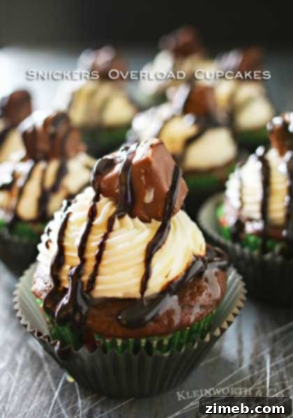 Rich and decadent Snickers Overload Cupcakes, a fun baking project for kids.