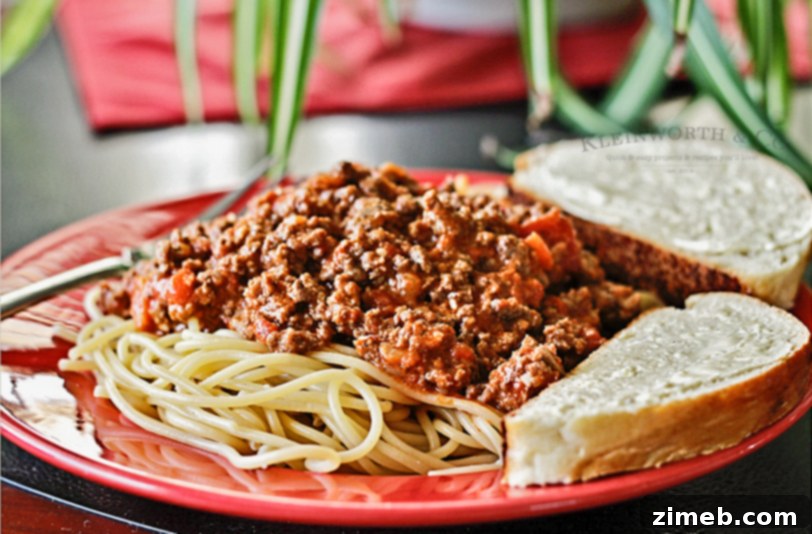 Happy children proudly presenting their homemade spaghetti and bread, a symbol of their culinary achievements.