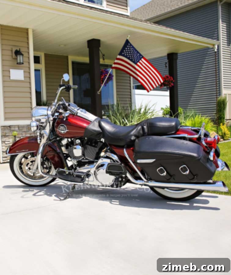Restore the Brilliance of Your White Walls 7 Husband using a Swiffer Duster to clean the motorcycle, keeping it show-quality.