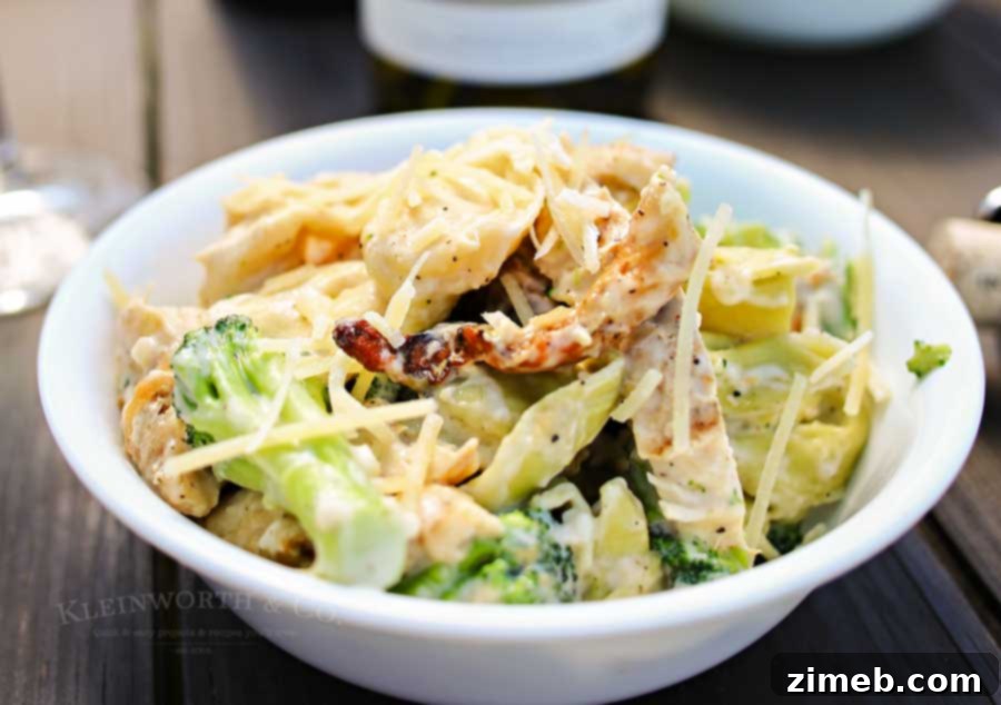 Grilled Chicken and Broccoli Tortellini 3 Grilled chicken, broccoli & tortellini in a creamy garlic cheese sauce makes this Grilled Chicken Broccoli Tortellini a delicious easy family dinner idea.