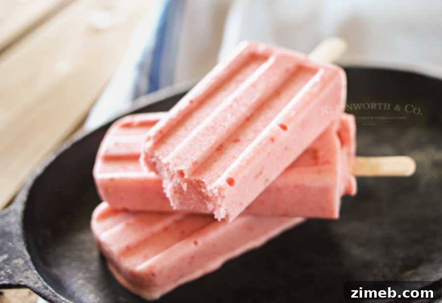 Close-up of creamy Strawberry Coconut Pops, highlighting their dairy-free texture.