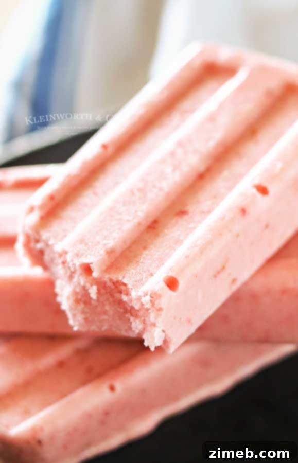Step-by-step image showing how to make Strawberry Coconut Pops.