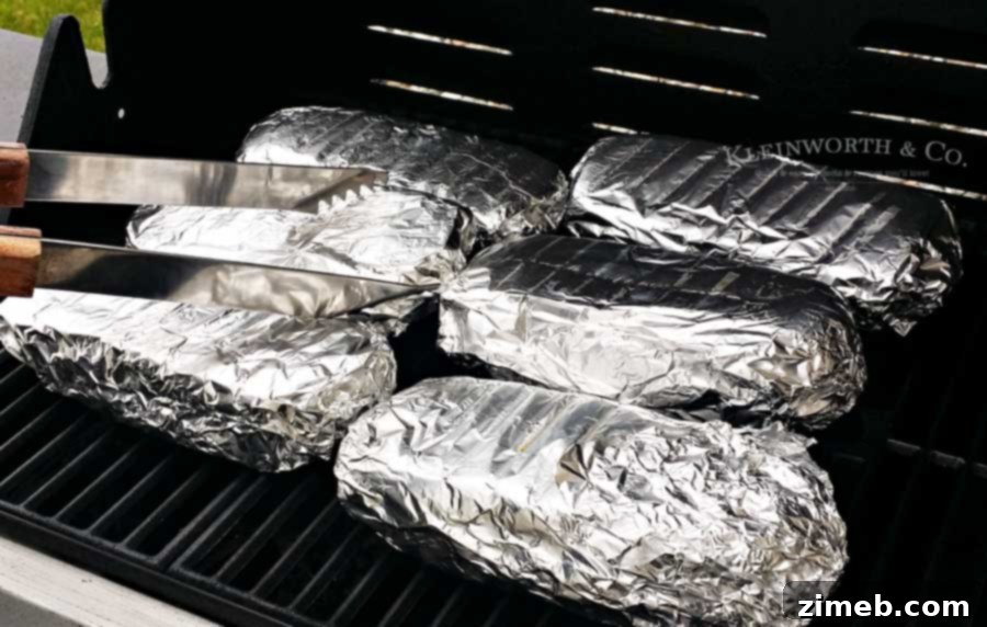 Signature Hot Pastrami Melt 7 Foil wrapped Grilled Hot Pastrami Sandwich ready for the grill