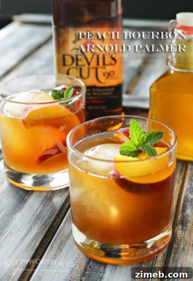 Peachwood Palmer 5 Hand holding a Peach Bourbon Arnold Palmer cocktail, ready to enjoy a perfect summer sip.