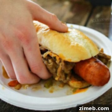 A delicious Philly Cheesesteak Hot Dog, ready to be enjoyed.