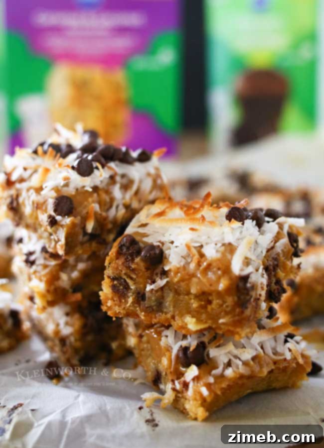 A stack of Caramel Coconut Blondies on a white plate, ready to be served.
