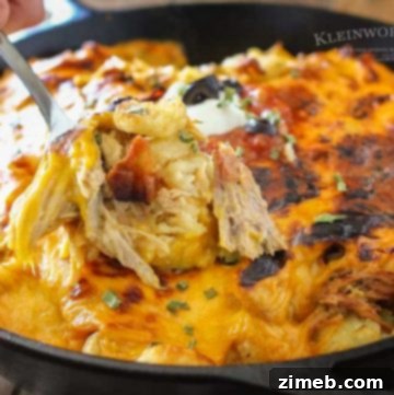 Loaded Tater Tot Casserole with melted cheese and toppings