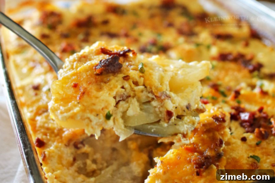 Creamy Bacon Scalloped Potatoes 2 Close-up of golden brown Bacon Scalloped Potatoes, bubbling with cheese and bacon bits, fresh from the oven, perfect for a hearty dinner side.