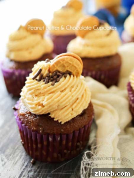 Peanut Butter Chocolate Cupcakes are the perfect cupcake recipe for peanut butter & chocolate lovers. Topped with a peanut butter cookie & sprinkles- Yummy!