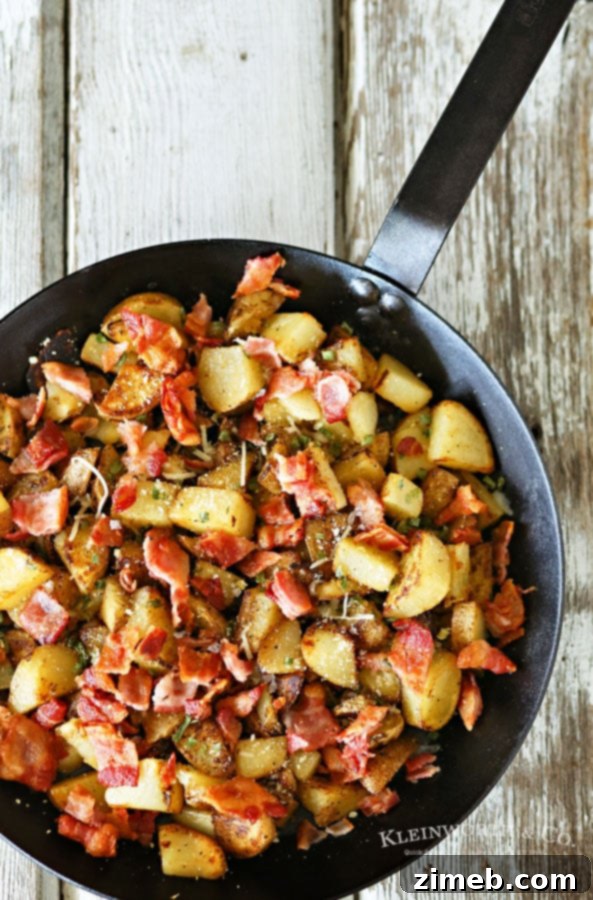 Crispy Golden Skillet Potatoes with Smoky Bacon 3 A serving of Skillet Breakfast Potatoes & Bacon, garnished with fresh green chives and a sprinkle of cheese.