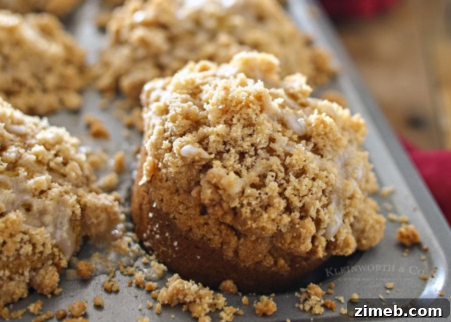 Crumble-Topped Pumpkin Harvest Muffins 5 A batch of the best Pumpkin Streusel Muffins on a cooling rack