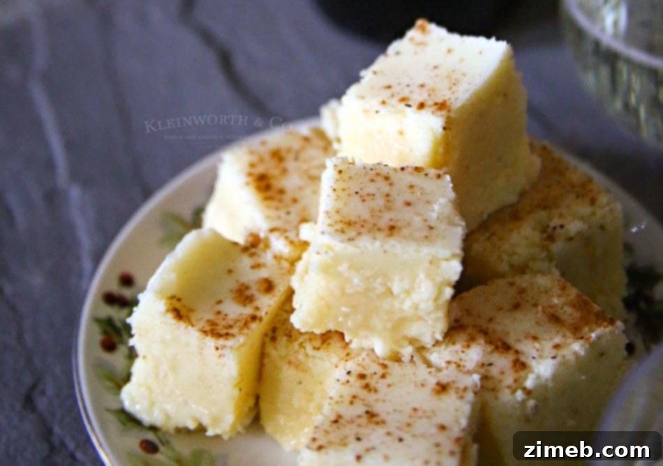 Melt Away Holiday Stress with Eggnog Fudge 3 Eggnog Fudge squares arranged on a serving plate.