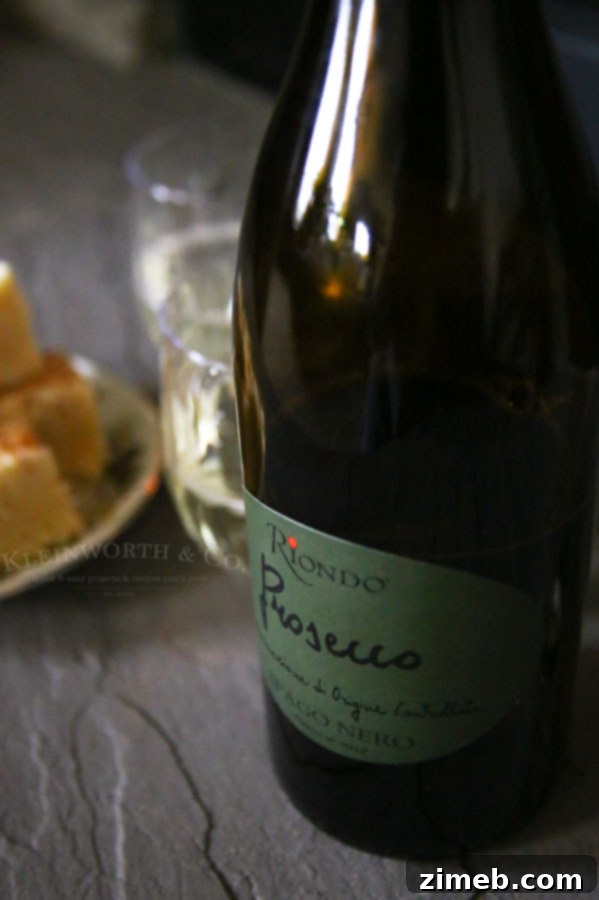 Melt Away Holiday Stress with Eggnog Fudge 5 Bottle of Riondo Prosecco next to a glass.