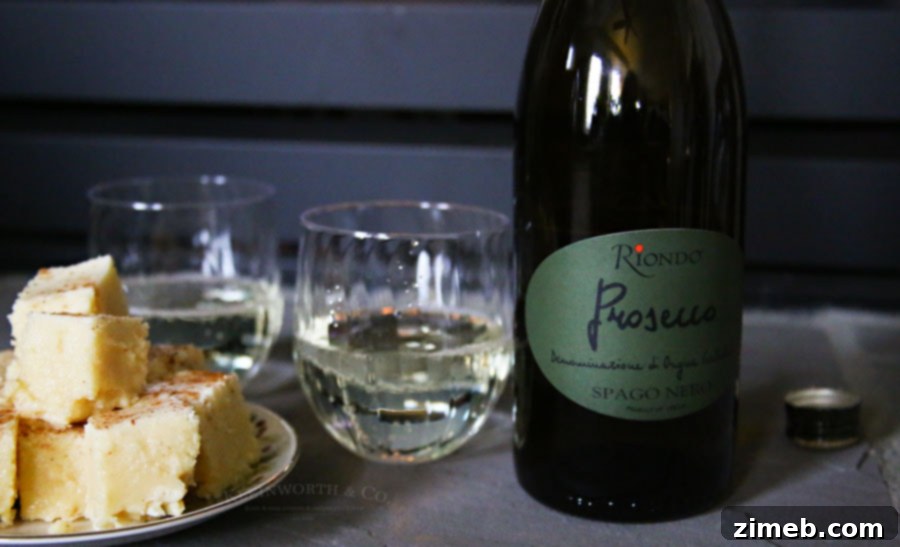 Melt Away Holiday Stress with Eggnog Fudge 6 Riondo Prosecco bottles and glasses on a festive table.