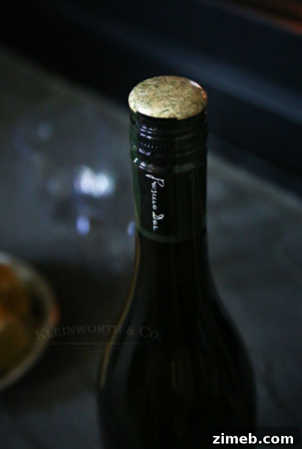 Melt Away Holiday Stress with Eggnog Fudge 7 Hand holding a glass of Riondo Prosecco.