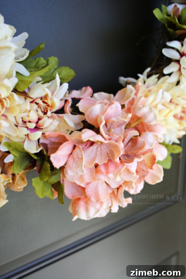 Grateful Harvest Wreath 5 Focus on pink and brown silk flowers on the wreath