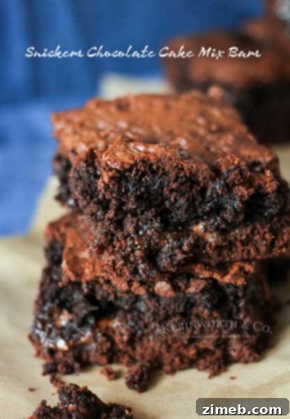 Java Peanut Butter Delights 6 Snickers Chocolate Cake Mix Bars are like a super thick but chewy brownie. A simple cake mix brownie loaded with candy bars that are just another yummy bar recipe you don't want to miss. YUM! I absolutely swoon over these.