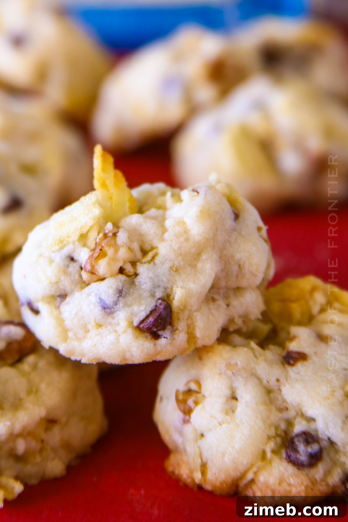 Salty-Sweet Walnut Chip Bliss 17 A plate of shortbread cookies with visible potato chips, chocolate chips, and walnuts