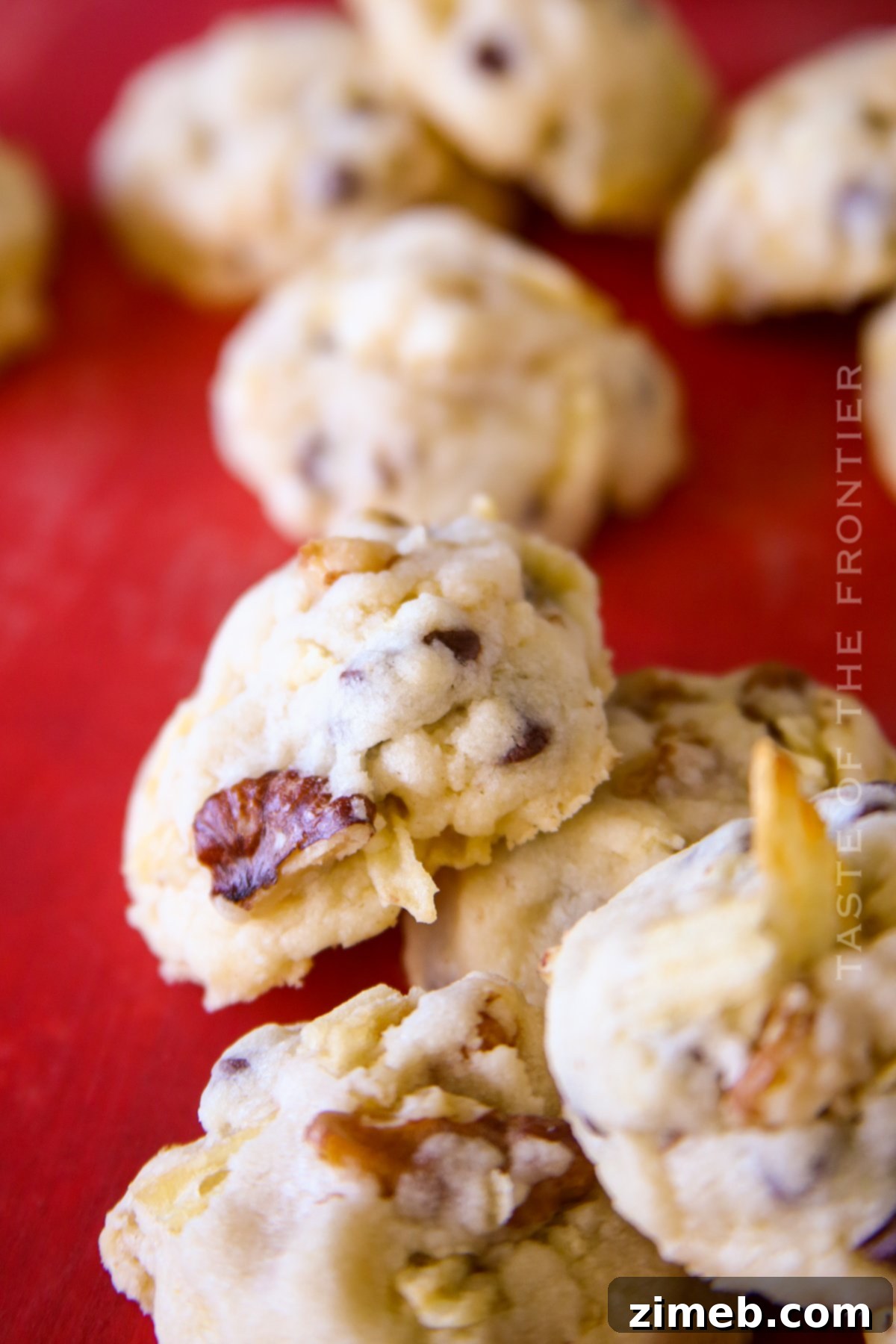 Salty-Sweet Walnut Chip Bliss 5 Close-up of baked chunky cookies with visible walnuts and mini chocolate chips