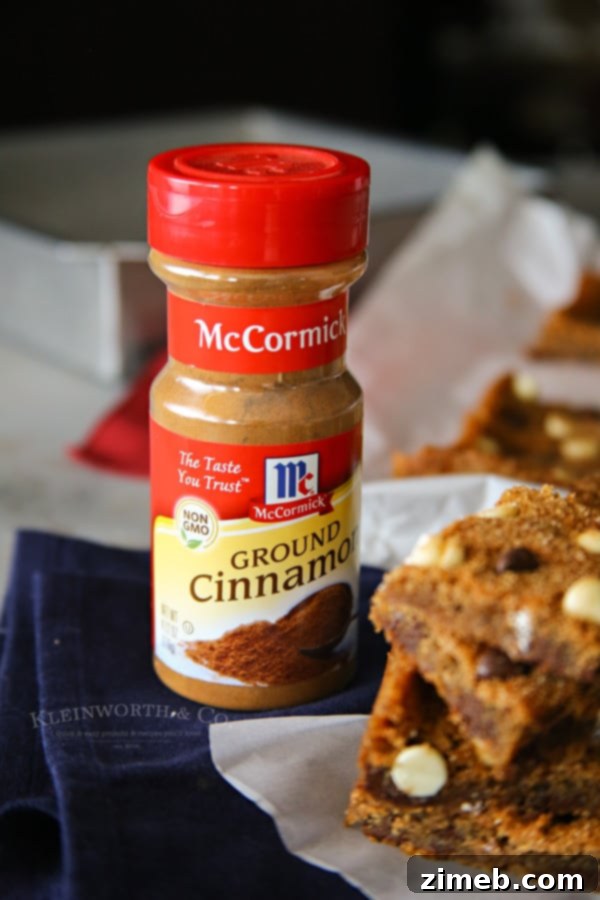 Homemade Chocolate Chip Snickerdoodle Bars cooling on parchment paper