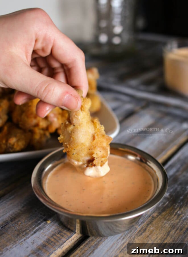Golden Crisp Flavor Wings 6 A bowl of creamy Sriracha Ranch Dipping Sauce, perfect for game day snacks.