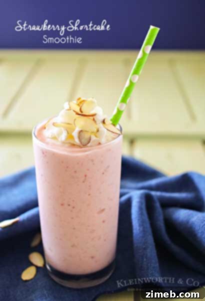 Strawberry Shortcake Smoothie in a glass with a straw