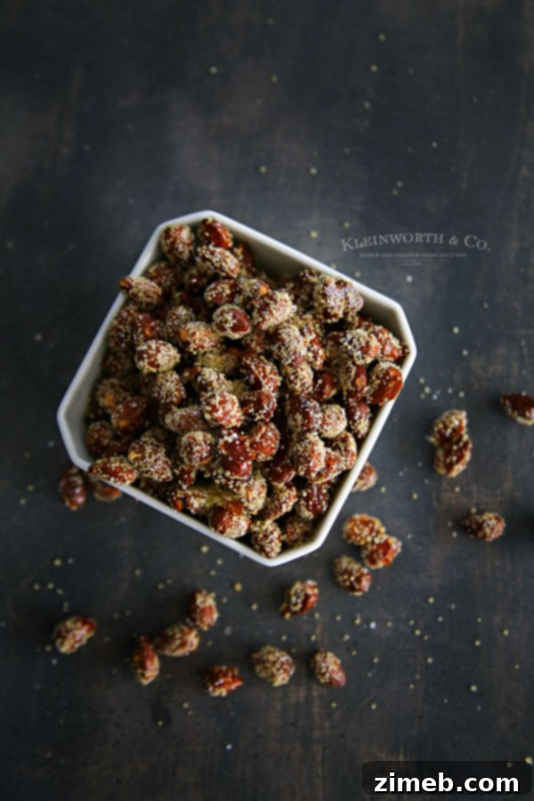 A bowl of freshly made honey roasted almonds, glistening.