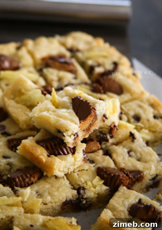 Sweet and Salty Reese's Potato Chip Cookie Bars 2 Close-up of Reese's Potato Chip Cookie Bars, showing the texture and delicious toppings.