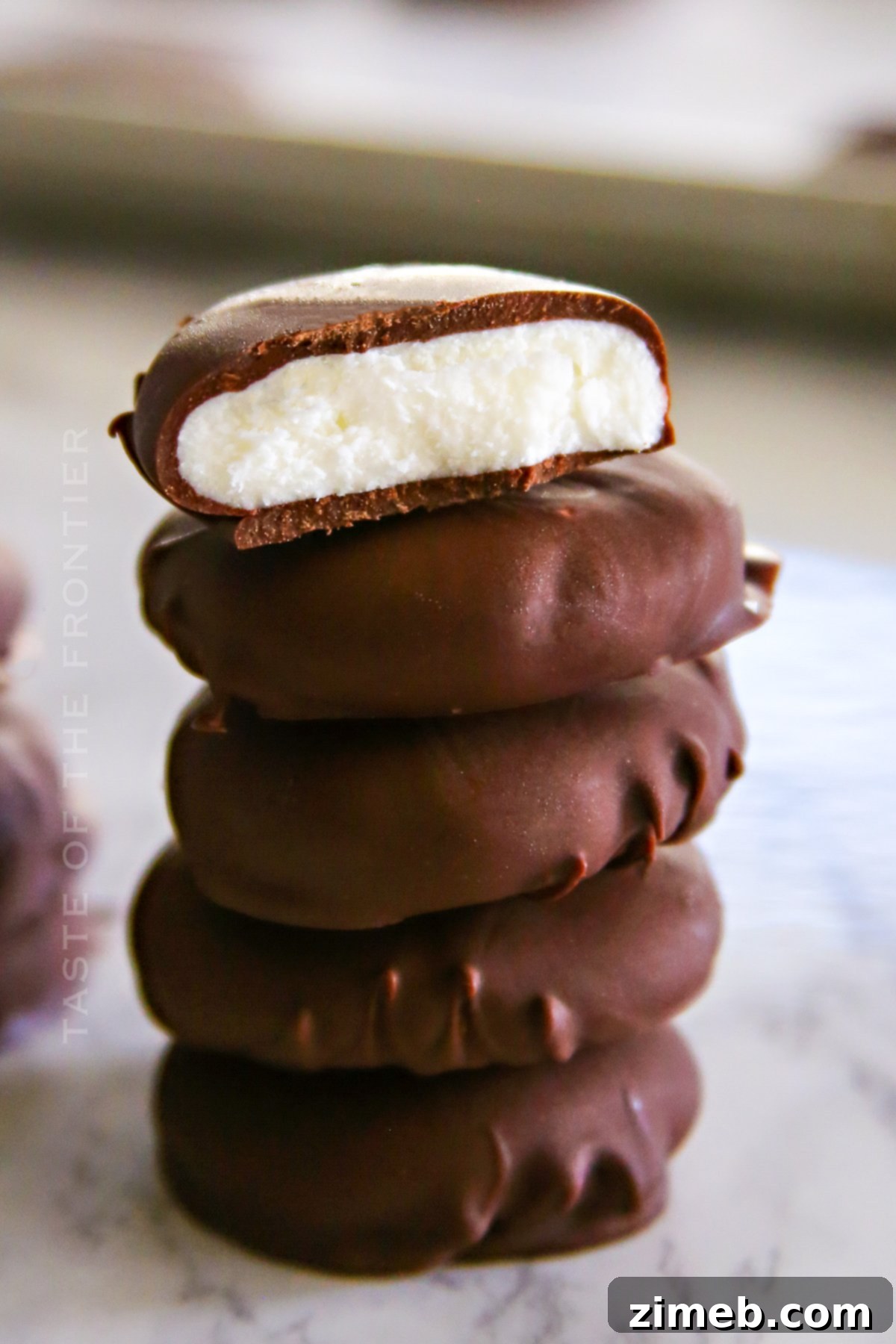 Homemade Peppermint Patties - dark chocolate exterior with white minty filling visible
