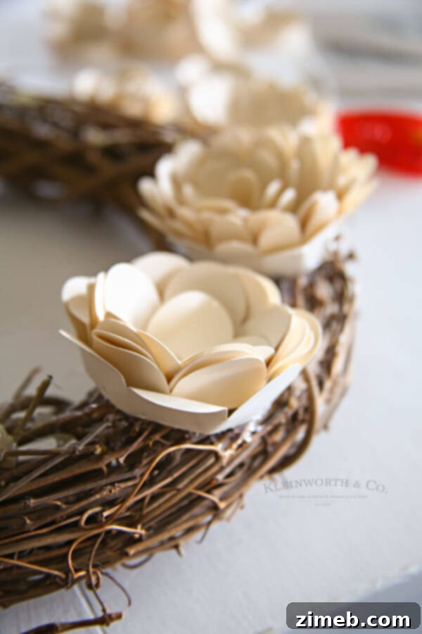 Craft a Beautiful Paper Flower Wreath with Cricut 10 Rolled paper flowers ready for wreath assembly