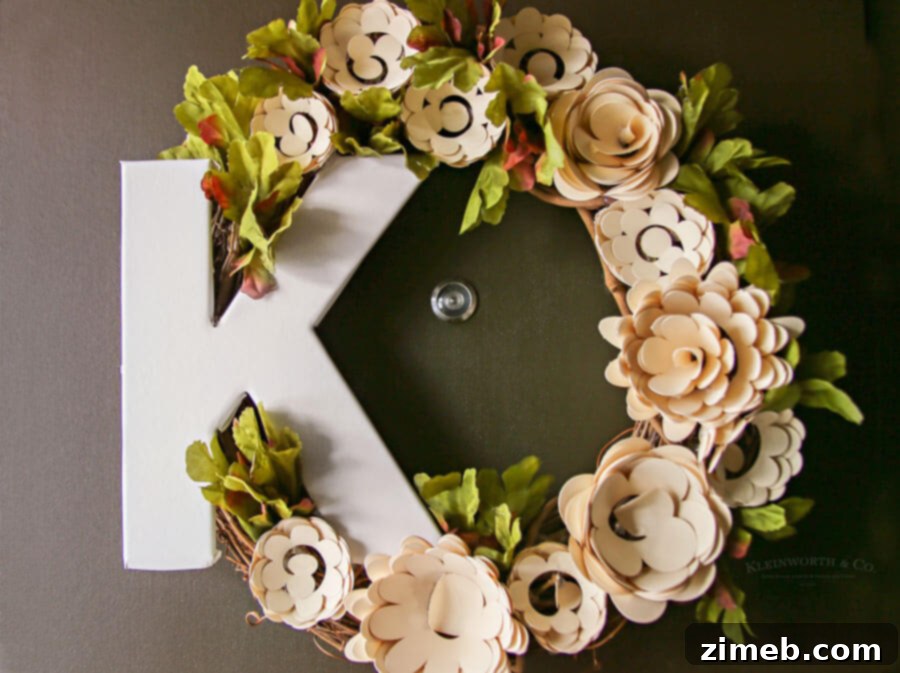 Craft a Beautiful Paper Flower Wreath with Cricut 11 Hot gluing paper flowers onto a grapevine wreath base