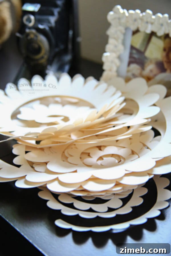 Craft a Beautiful Paper Flower Wreath with Cricut 8 Weeded paper flower cutouts on Cricut mat
