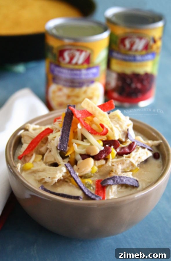 Prepared Slow Cooker White Chicken Chili served in a bowl with toppings