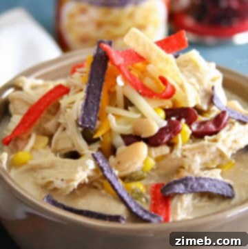 Slow Cooker White Chicken Chili served with fresh toppings