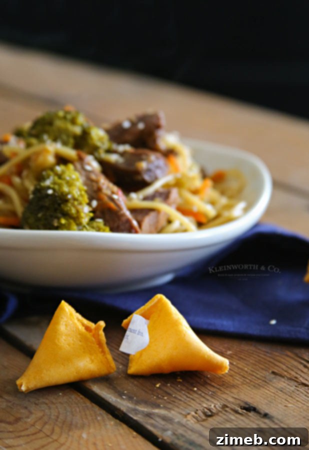 Ingredients being added to a slow cooker for Teriyaki Beef Lo Mein.