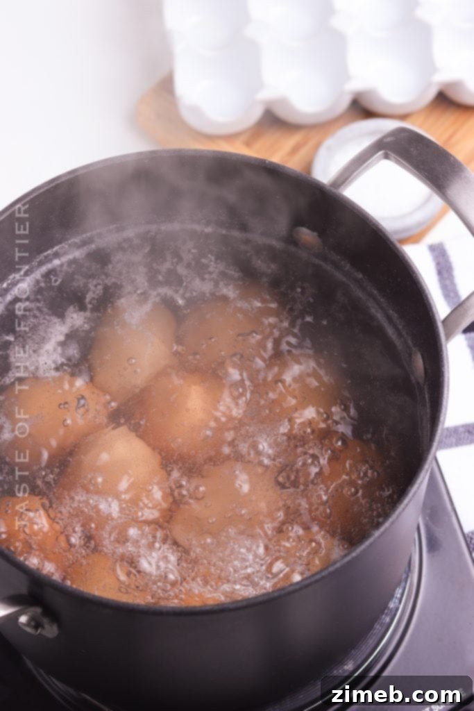 Foolproof Hard Boiled Eggs 6 Easy peeling of a hard-boiled egg under running water
