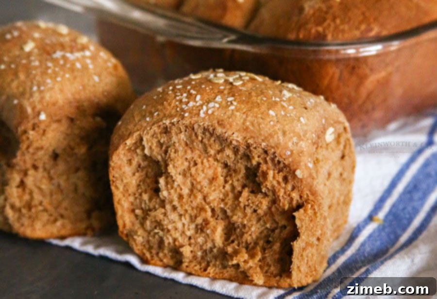 One Hour Brown Bread Dinner Rolls served with a knob of butter.