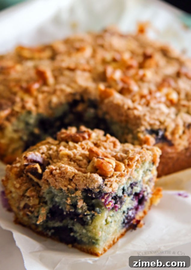 Slice of Blueberry Coffee Cake with fresh blueberries