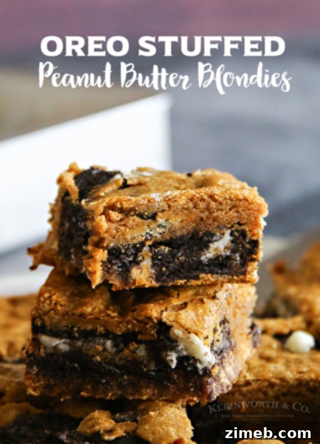 Oreo Peanut Butter Blondie Delights 6 A perfectly sliced Oreo Stuffed Peanut Butter Blondie, showcasing the visible Oreo layer and the chewy texture.