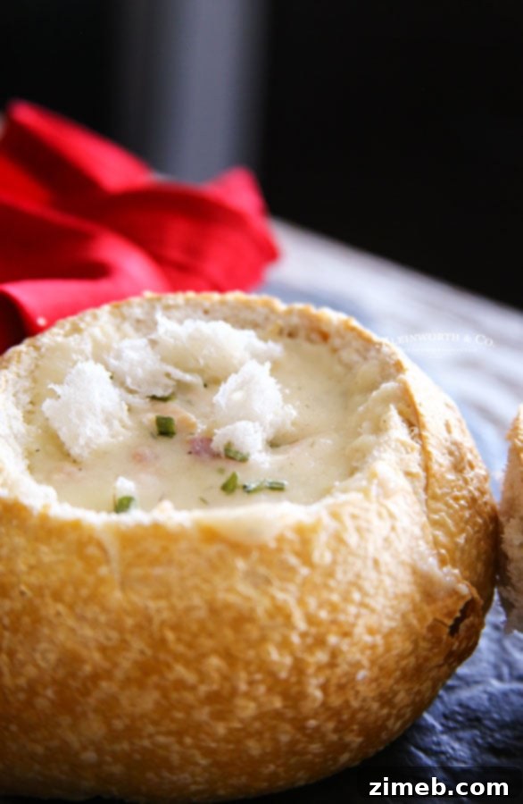 Sourdough bread bowl filled with creamy clam chowder, resembling the Disneyland classic.
