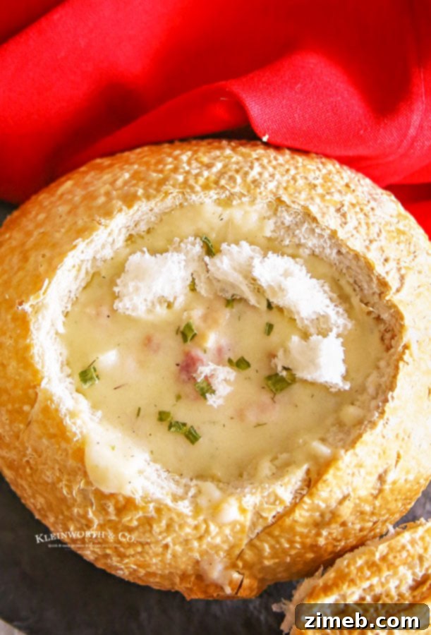 Clam chowder simmering in a slow cooker, illustrating the ease of preparation.
