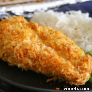 Golden Crispy Sriracha Cheesy Chicken Bake 4 A close-up of a single portion of Crispy Sriracha Cheesy Chicken Bake, ready to be served, highlighting the crispy texture.