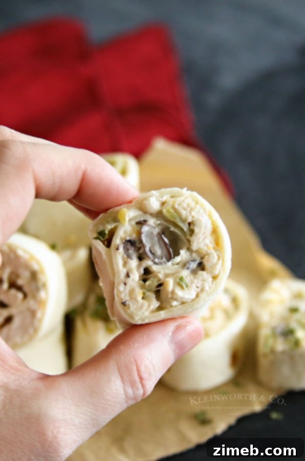 Creamy Chicken Verde Pinwheels - showing the mixture spread on tortillas.
