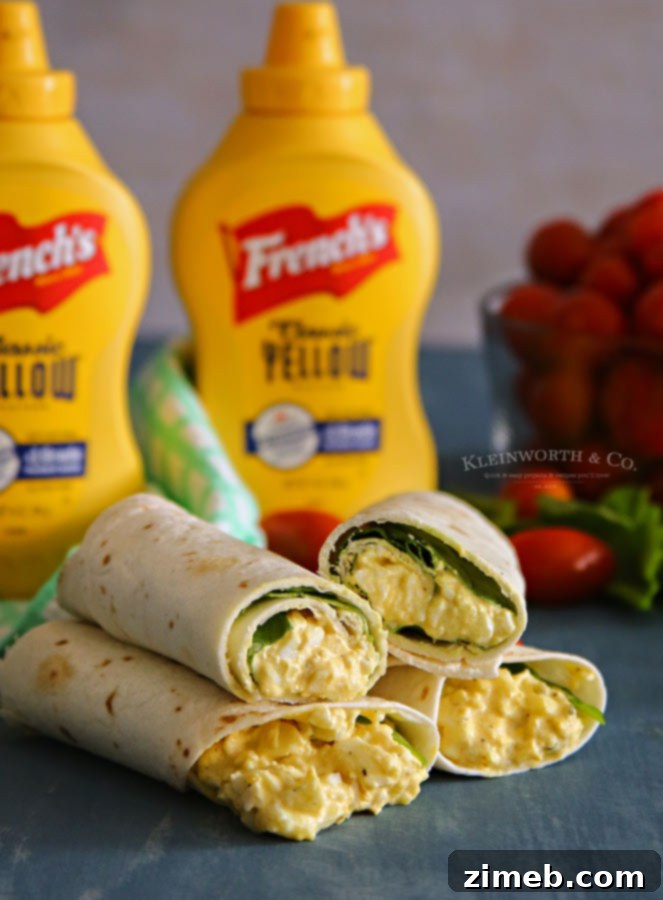 Garden Fresh Egg Salad Wraps 2 A close-up of a perfectly rolled Egg Salad Spinach Wrap, showing the creamy filling and fresh greens