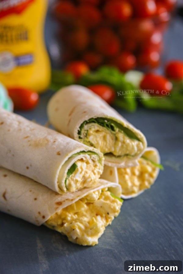 Garden Fresh Egg Salad Wraps 4 Closeup of a bowl of creamy egg salad, ready to be spread into spinach wraps, with a bottle of French's Classic Yellow Mustard in the background
