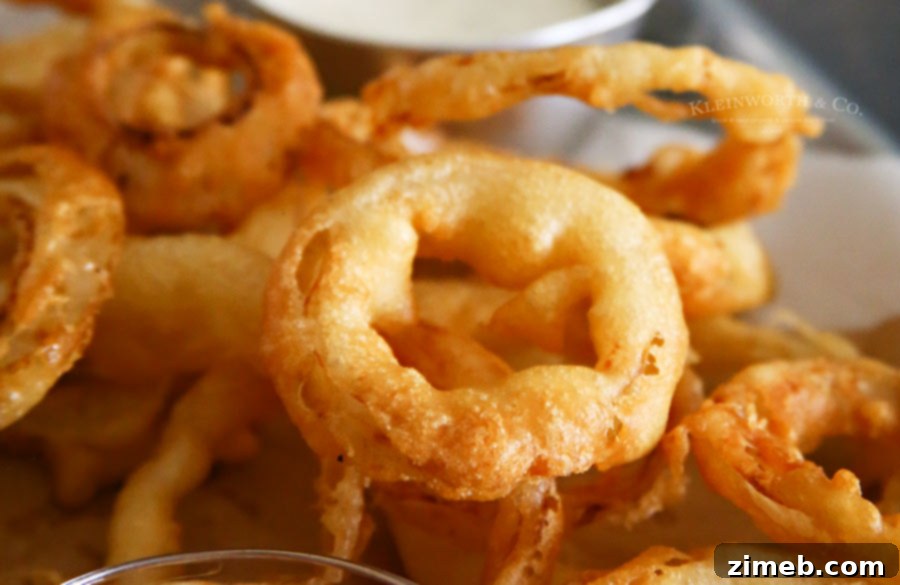 Crispy Golden Beer-Battered Onion Rings 3 Golden-brown Beer Battered Onion Rings served with dipping sauce