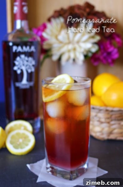 Crispy Golden Beer-Battered Onion Rings 7 Refreshing Pomegranate Hard Iced Tea in a glass